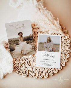 two photos are laying on a doily next to a white blanket and some feathers