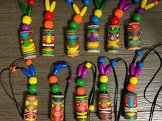 many colorful beads are on the table next to each other and some wires in front of them