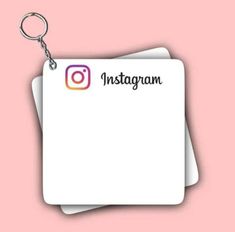 the instagram logo is attached to two square white cards with a metal keychain