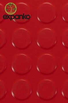 a close up of a red plastic plate with circles on the bottom and an exponto logo above it