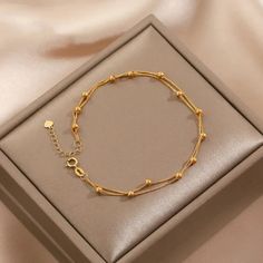 This Beautiful Light Weight Bracelet Is A Must-Have For Any Fashion-Forward Individual. The Combination Of Gold And Titanium Plated Metal Create A Unique And Stunning Piece That Will Instantly Elevate Any Outfit. The Length Is Adjustable To 8 Inches. The Beaded Chain Design Adds A Touch Of Charm And Elegance, Making It A Perfect Accessory For Any Occasion. The Bracelet Features A Bead Charm And Is Available In A Variety Of Colors, Making It Easy To Match With Any Outfit. It Is Suitable For Both Delicate Gold Bracelet, Unique Gold Jewelry Designs, Gold Bracelet Simple, Gold Bangles For Women, Gold Chain Design, Gold Jewelry Stores, Gold Rings Fashion, Gold Ring Designs, Gold Jewelry Simple