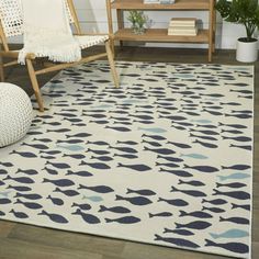 Complement your coastal decor with this Mod-Tod area rug. The plush polypropylene pile is detailed with a fish pattern for nautical charm. Stain-resistant and non-shedding, the durable carpet is ideal for busy living areas or kid's playrooms. Features: Made of polypropylene Nautical, coastal style Fish pattern Cream or navy color Machine-made Indoor only Kid and pet-friendly Stain-resistant Non-shedding Suitable for high-traffic areas 0.25-0.5-inch pile height See options for available sizes Siz Coastal Area Rug, Coastal Area Rugs, School Of Fish, Rug Cream, Durable Carpet, Target Rug, Navy Blue Area Rug, Blue Area Rug, Blue Area