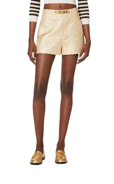 Sitting high on the waist, this pair of gold-tone tailored shorts from Valentino are detailed with the brand's signature VLogo signature logo plaque to the front. Crafted with a touch of silk, they feature a concealed side zip fastening and two inseam side pockets.Textured finishVLogo SignatureChain-link detailingHigh waistTwo side inset pocketsSide zip fasteningComposition: Polyester 39%, Silk 33%Lining: Viscose 63%, Silk 37%Outer: Metallic Fibre 28%Length from waist 34 cm / 13.3"Leg opening 69 Luxury Workwear Shorts, Luxury Formal Summer Bottoms, Luxury Summer Formal Bottoms, Summer Formal Luxury Bottoms, Luxury Short Length Bottoms For Workwear, Luxury Short Length Workwear Bottoms, Luxury Gold Party Bottoms, Elegant Gold Shorts For Summer, Elegant Formal Shorts With Short Inseam