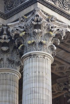 the columns are decorated with flowers and leaves