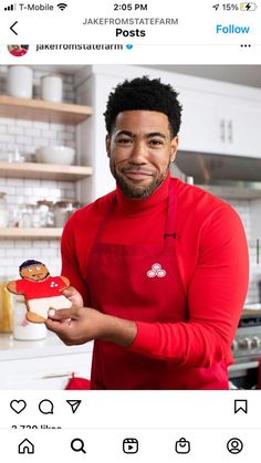 a man in red shirt holding up a toy