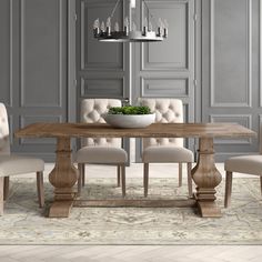 a dining room table with chairs and a bowl of food on top of the table