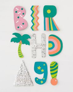 the letters are made up of different shapes and sizes, including palm trees with stars on them