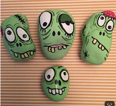 three green rocks with faces painted on them