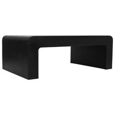 a black bench sitting on top of a white floor