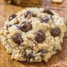 a chocolate chip cookie on a wooden table