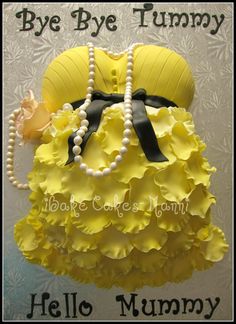 a cake made to look like a yellow dress