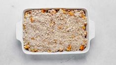 a casserole dish filled with oatmeal sitting on top of a table