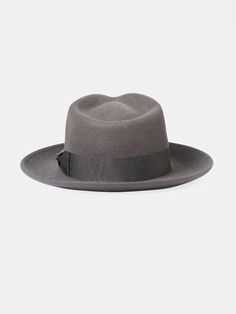 Don't let the name fool you; this 100% wool fedora is the real deal ✨ It's got that classic teardrop crown and a sleek grosgrain band, but the real game-changer is the adaptable brim. Flip it up, down, or half and half – this hat covers your style evolution. Plus, the adjustable velcro strap means a perfect fit every time. ✦ Unisexy! ✦ A classic 50s-inspired fedora you can wear three different ways. ✦ Adaptable convertible brim that can be flipped up or down. ✦ Features a grosgrain band and an a Classic Solid Color Brimmed Felt Hat, Classic Solid Top Hat With Flat Crown, Classic Solid Color Fur Felt Hat, Classic Fedora With Short Brim, Classic Fitted Fedora, Classic Top Hat For Fall, Flat Crown Fur Felt Fedora, Classic Brimmed Hat For Town, Classic Fedora Hat For Town