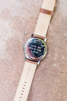 a watch that is laying on the ground