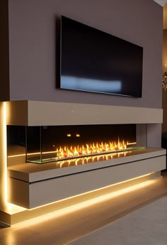 a large television mounted on the wall above a fire place in a modern living room