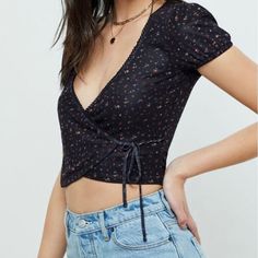 Super Cute Floral Top W/ Ties On The Side. Never Been Worn, Still Has Tags. Spring Flirty V-neck Crop Top, Flirty V-neck Spring Crop Top, Cute V-neck Crop Top For Spring, Spring V-neck Flirty Crop Top, Cute Black Summer Crop Top, Cute Black Crop Top For Summer, Black Printed Crop Top For Spring, Cute Black Floral Print Tops, Flirty Black Crop Top For Spring