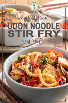 a bowl filled with noodles and vegetables next to chopsticks