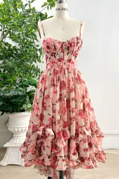 Elevate your style with our Spaghetti Straps Corset V Neck Floral Print Chiffon High Low Dress. The delicate spaghetti straps and corset bodice add a touch of elegance, while the vibrant floral print and flowing chiffon create a whimsical and sophisticated look. Perfect for any special occasion, this dress will make you feel confidently, beautifully unique. Bodice and skirt are fully lined. 100% Polyester 100% Recycled polyester lining Concealed zip at center back Imported Princess Attire, Look 80s, Floral Pattern Dress, Floral Print Chiffon, Fantasy Gowns, Dream Dresses, Tea Length, Print Chiffon, Dress Inspo