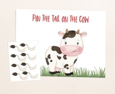 a card with a cow on it and some stickers next to it that says pin the tail on the cow