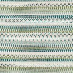 a blue and green striped rug with small dots