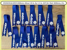 blue ribbon with white letters and volleyballs on them are laid out next to each other