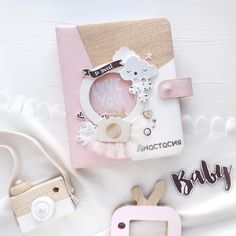 a baby girl album with pink and white accessories