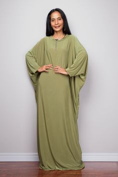 "Olive Green Kaftan Dress, Maxi Dress, Long boho dress, Loose fit dress, Modest dress, Green kaftan with pockets PRODUCT SIZE : One Size Fits Most * Chest : free up to 58\" * Waist : free up to 58\" * Hips : free up to 58\" * Circumference bottom hem : 45\" * Length : 56\" * Sleeve length : 23\" MATERIAL * Spandex Venetia * Zipper on the back MODEL : * Model chest : 32\", Height 160 cm (5.2) without high heel * Accessories excluded Produced by NUICHAN IMPORTANT NOTE *Please note that colours sho Oversized Green Tunic Dress, Green Flowy Long Sleeve Kaftan, Flowy Green Long Sleeve Kaftan, Green Long Sleeve Bohemian Abaya, Green Loose Fit Long Maxi Dress, Green Oversized Long Sleeve Kaftan, Oversized Long Sleeve Green Kaftan, Green Casual Tunic Kaftan, Green Flowy Tunic Maxi Dress