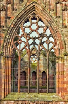 an old building with a very large window