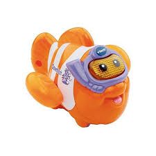 an orange and white clown fish toy with goggles on it's head, swimming