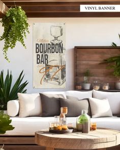 a living room filled with furniture and potted plants on top of a wooden table