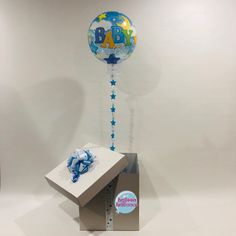 a baby shower balloon is in the shape of a box