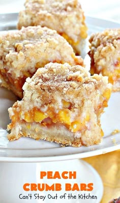 peach crumb bars on a white plate with the words peach crumb bars can't stay out of the kitchen