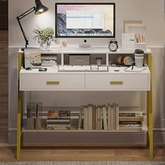 a computer monitor sitting on top of a white desk