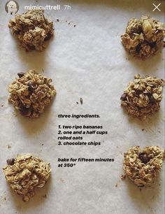 six cookies are arranged on top of parchment paper