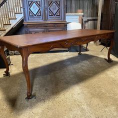 an old wooden table in a room