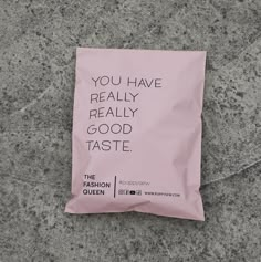 a pink bag with the words you have really really good taste on it sitting on concrete