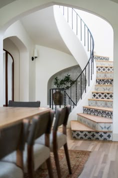 the stairs in this house are made of wood and have been painted with an intricate pattern