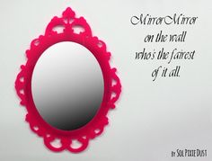 a pink mirror sitting on top of a white wall next to a quote that says mirror mirror on the wall who's the fairest of it all