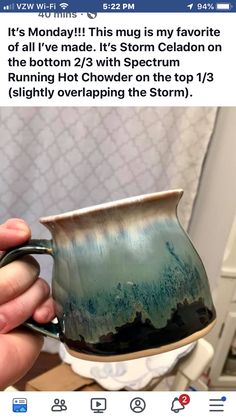 someone is holding a mug in their hand and it looks like they are going to storm celadon on the bottom