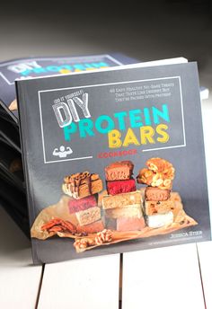 a book about protein bars sitting on top of a table