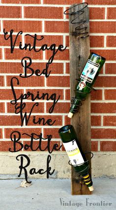 an old wine bottle rack made out of pallet wood with the words vintage bed spring wine bottle rack on it