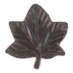 a black leaf shaped object on a white background