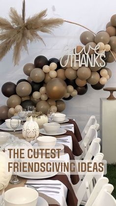 a table set up with white and brown plates, silverware and black and white napkins