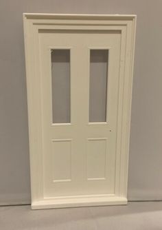 a white door with two glass panels on the side