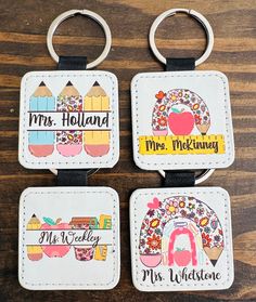 three keychains with different designs on them