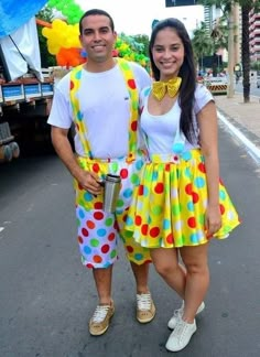 a man and woman dressed in clown costumes