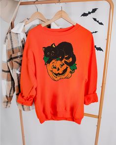 Vintage Black Cat Halloween Sweatshirt to spice up your fall wardrobe!  This sweatshirt design is screen printed. We do not embroider. 8 oz., 50% cotton, 50% polyester 1x1 ribbed collar, cuffs and waistband with spandex Double-needle stitching throughout Pill-resistant air jet yarn Set-in sleeves Tear-away label CARE INSTRUCTIONS -Wash item inside out in cold water -Do not iron directly on the design -Do not dry clean -Do not bleach Vintage Black Cat Halloween, Vintage Black Cat, Cat Halloween, Halloween Stuff, Womens Shirt, Pumpkin Shirt, Black Cat Halloween, Halloween Sweatshirt, Halloween Cat