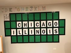 the chicago illinois sign is hanging on the wall in an office space with letters and numbers above it