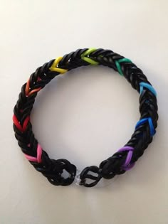 a multicolored bracelet on a white surface