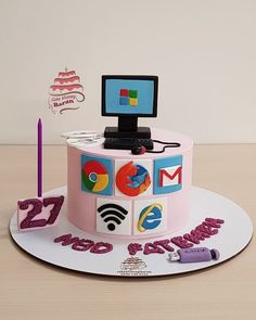 a birthday cake with a computer on top